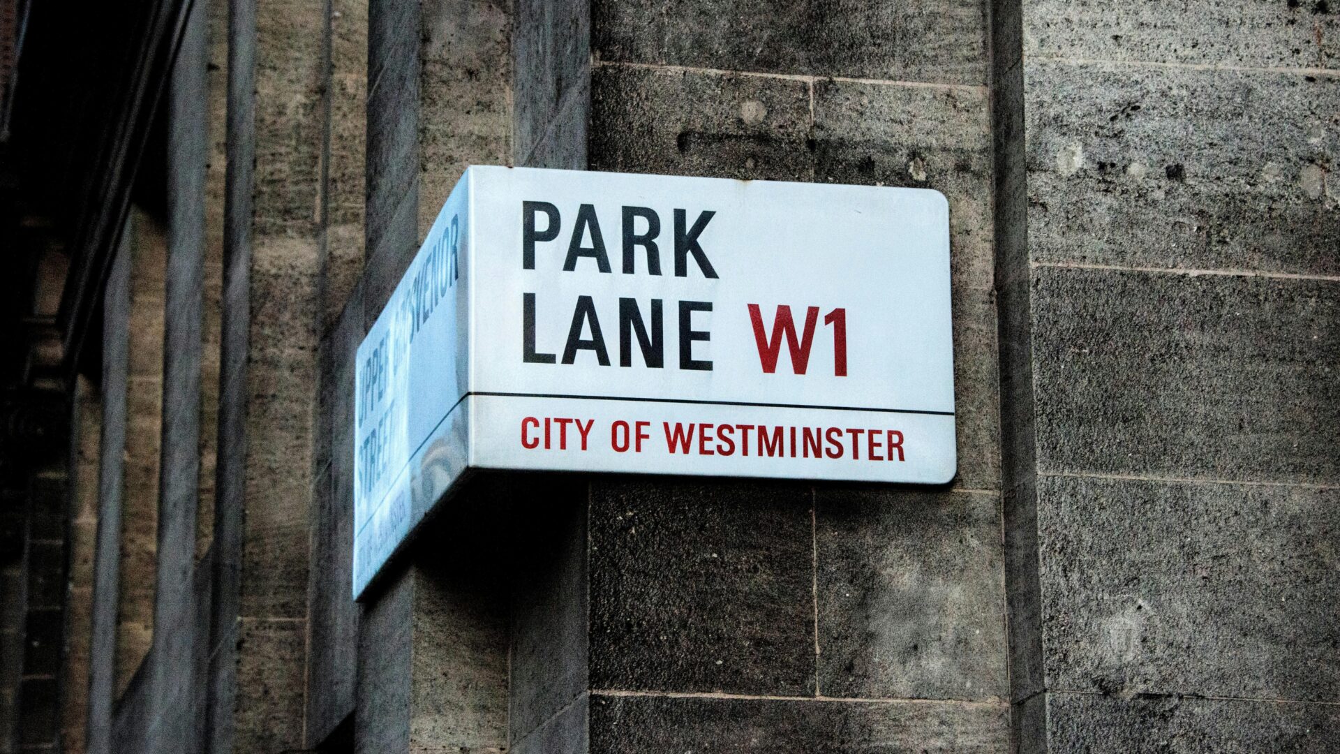 A classic Westminster street sign for a Mayfair address, signifying brand prestige.